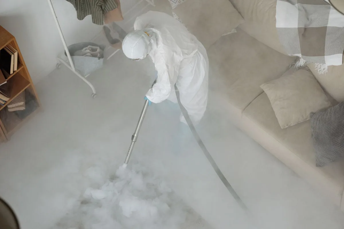 Biohazard cleanup technician in protective equipment, Brooks, KY